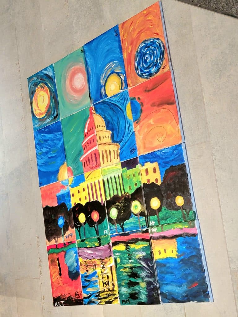 A colorful mosaic painting of the U.S. Capitol building surrounded by vivid swirls and abstract designs, with a reflection in the water below &mdash; perfect for a paint and sip DC event.