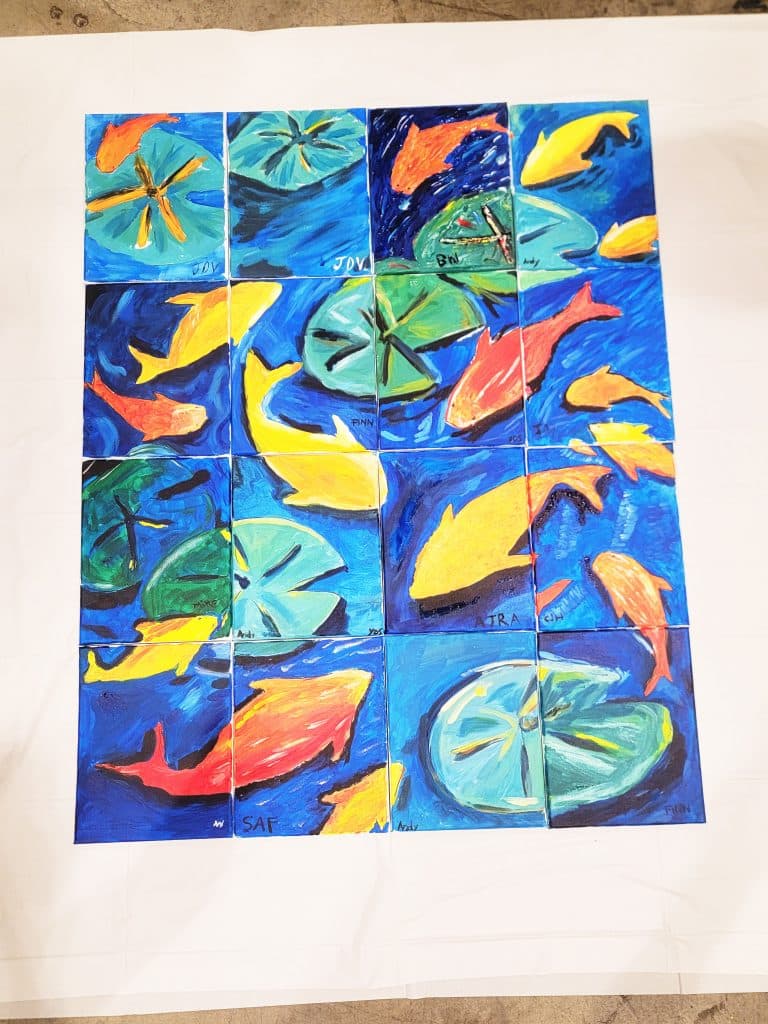 A colorful painting composed of sixteen tiles arranged in a grid, depicting yellow and orange fish swimming among green lily pads against a blue background.